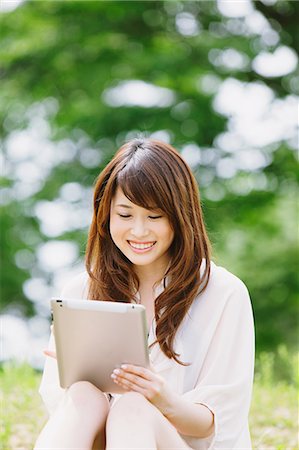 Young woman with tablet Stock Photo - Rights-Managed, Code: 859-06538063