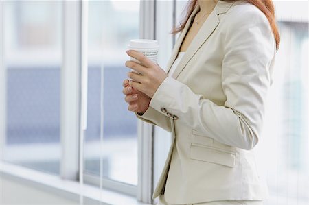 Businesswoman with a cup of coffee Stock Photo - Rights-Managed, Code: 859-06538162