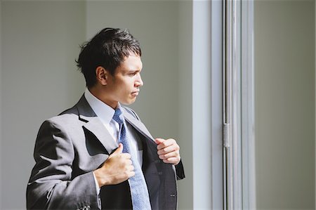 Businessman looking out of the window Stock Photo - Rights-Managed, Code: 859-06538183