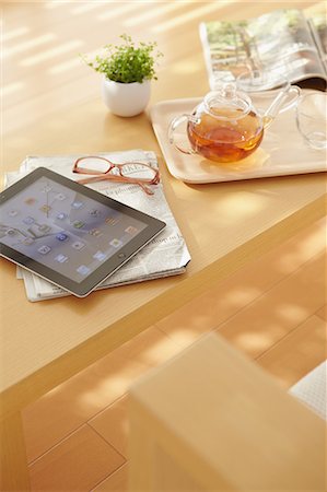 floor and nobody - Tea tablet and newspapers on a table Stock Photo - Rights-Managed, Code: 859-06538440