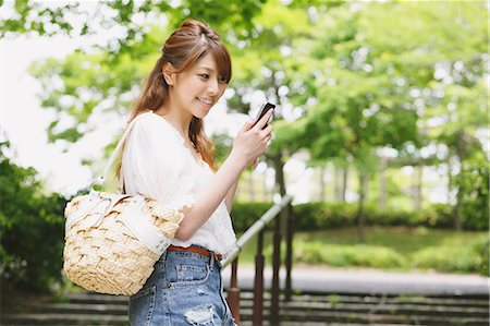 Woman Checking Smartphone Stock Photo - Rights-Managed, Code: 859-06617466