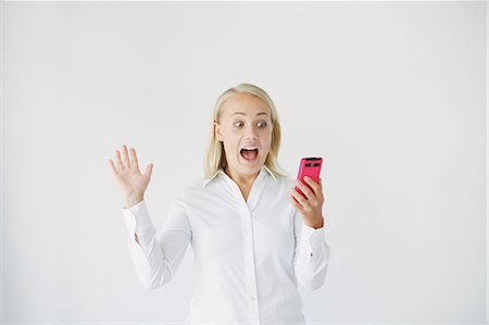 Businesswoman getting surprised Stock Photo - Rights-Managed, Code: 859-06711027