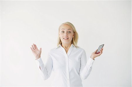 Businesswoman getting surprised Stock Photo - Rights-Managed, Code: 859-06711028