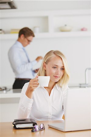 Woman with a notebook drinking coffee Stock Photo - Rights-Managed, Code: 859-06711033