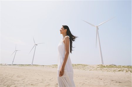 energy generation - Woman in a white dress on the beach smiling away Stock Photo - Rights-Managed, Code: 859-06808523