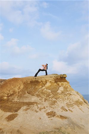 Woman practicing Yoga on a cliff Stock Photo - Rights-Managed, Code: 859-06808539