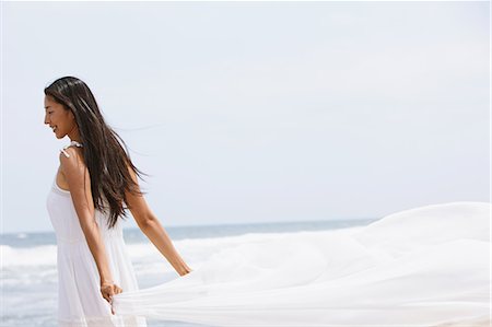 feel - Woman in a white dress with white cloth on the beach Stock Photo - Rights-Managed, Code: 859-06808544