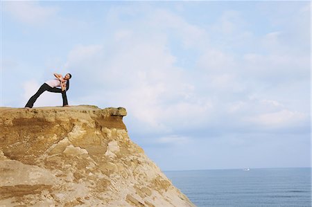 simsearch:622-06964353,k - Woman practicing Yoga on a cliff Stock Photo - Rights-Managed, Code: 859-06808602