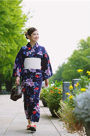 Japanese woman in a Yukata walking Stock Photo - Rights-Managed, Code: 859-06824589