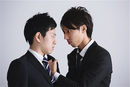 Young Japanese businessmen fighting Stock Photo - Rights-Managed, Code: 859-07711144