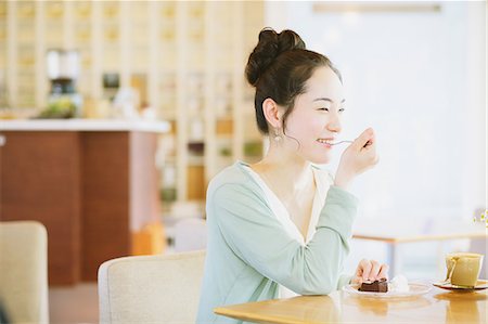 people eating at a coffee shop - Japanese woman relaxing in a cafe Stock Photo - Rights-Managed, Code: 859-07845831