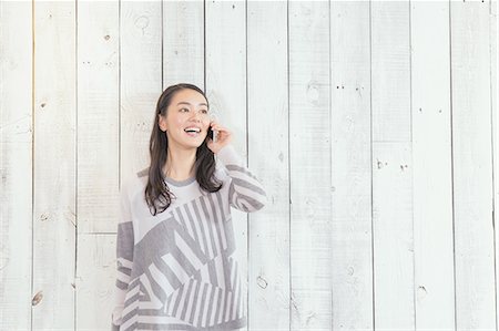 simsearch:622-08519691,k - Young Japanese woman on the phone in a stylish office Stock Photo - Rights-Managed, Code: 859-08173124