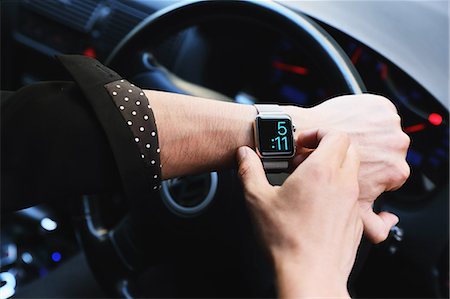 Japanese man in the car with wearable smart watch Stock Photo - Rights-Managed, Code: 859-08384663