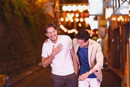 simsearch:400-05706130,k - Caucasian man enjoying nightlife in Tokyo with Japanese friend, Japan Stock Photo - Rights-Managed, Code: 859-08805919