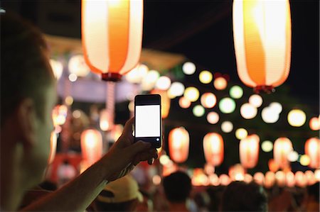 simsearch:859-06710957,k - Caucasian man taking pictures at Japanese traditional Bon Odori festival Stock Photo - Rights-Managed, Code: 859-08805946