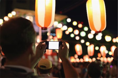 simsearch:859-06710957,k - Caucasian man taking pictures at Japanese traditional Bon Odori festival Stock Photo - Rights-Managed, Code: 859-08805947