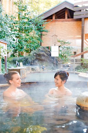 saturated - Caucasian woman with Japanese friend bathing at traditional hot spring, Tokyo, Japan Stock Photo - Rights-Managed, Code: 859-08993803