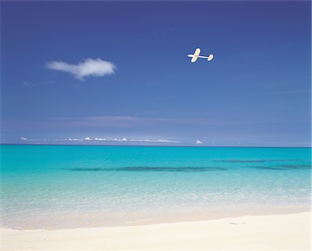 A Plane Flying Near The Coastline Stock Photo - Rights-Managed, Code: 859-03036472