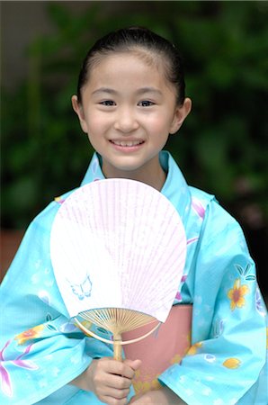 Young girl in yukata holding fan Stock Photo - Rights-Managed, Code: 859-03037226