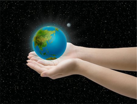 simsearch:400-04265415,k - Close-up of hands holding glowing globe Stock Photo - Rights-Managed, Code: 859-03038778