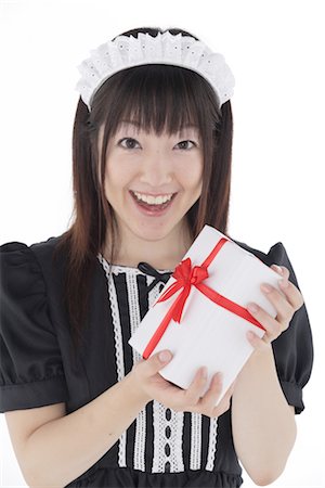 Cute Japanese maid with gift package Stock Photo - Rights-Managed, Code: 859-03038809