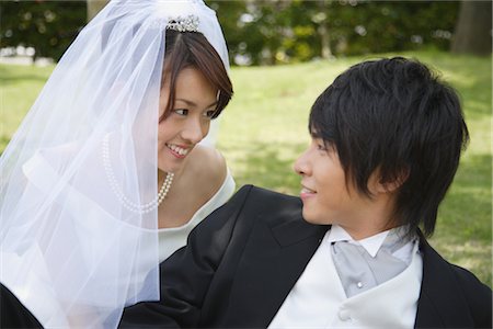 simsearch:859-03039180,k - Bride and Groom Laying on Grass Stock Photo - Rights-Managed, Code: 859-03039119