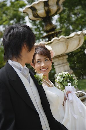 simsearch:859-03039180,k - Bride and Groom Walking in Garden Stock Photo - Rights-Managed, Code: 859-03039137