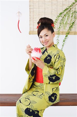 Woman in Kimono Eating Dessert Stock Photo - Rights-Managed, Code: 859-03039439