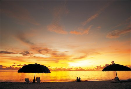 Couple At The Beach At Sunset Stock Photo - Rights-Managed, Code: 859-03041648