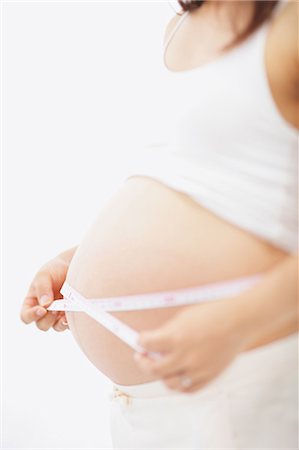 Mesurer le ventre de la femme enceinte Photographie de stock - Rights-Managed, Code: 859-03600089
