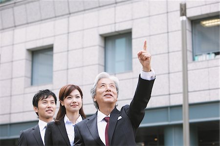 research building - Businessman And Businesswoman Looking Up Stock Photo - Rights-Managed, Code: 859-03600382