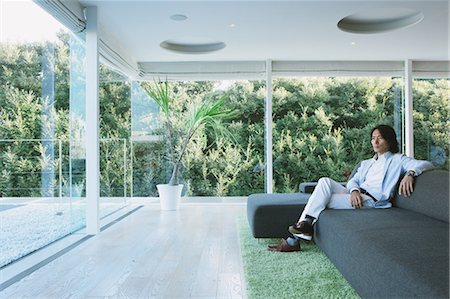 Man Relaxing In Living Room Stock Photo - Rights-Managed, Code: 859-03601273