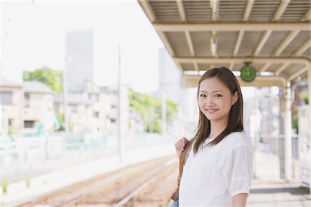 railway japan photography - Japanese Teenage Girl Waiting On Platform Stock Photo - Rights-Managed, Code: 859-03730588