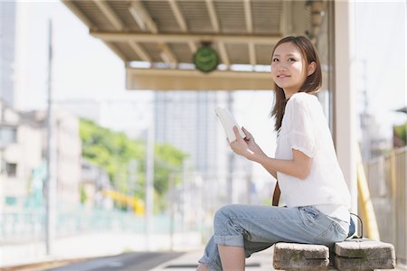 people waiting at train station - Japanese Teenage Girl Waiting On Platform Stock Photo - Rights-Managed, Code: 859-03730595