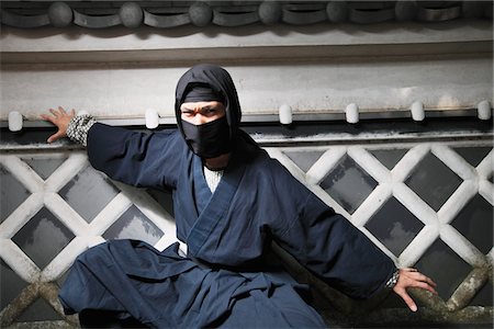 spying - Masked Ninja Crouching By Wall Stock Photo - Rights-Managed, Code: 859-03730698