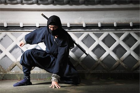 spying - Masked Ninja Crouching By Wall Stock Photo - Rights-Managed, Code: 859-03730701