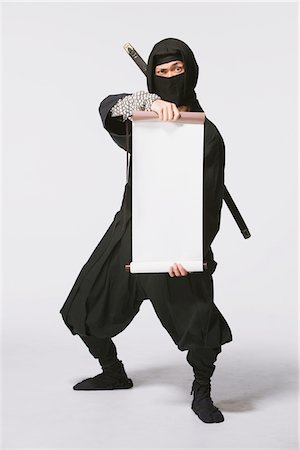 scroll (design) - Ninja Holding A Scroll Stock Photo - Rights-Managed, Code: 859-03730760