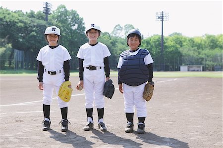 playing baseball - Joueur de baseball qui posent au terrain de jeux Photographie de stock - Rights-Managed, Code: 859-03755416