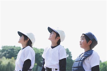 playing baseball - Vue latérale des trois joueurs de Baseball Photographie de stock - Rights-Managed, Code: 859-03755419