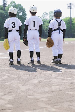 determined youth sports - Baseball Friends Standing In Baseball Field Stock Photo - Rights-Managed, Code: 859-03755424