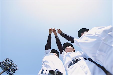 playing baseball - Baseball joueurs mains vers le haut dans l'Air Photographie de stock - Rights-Managed, Code: 859-03755431