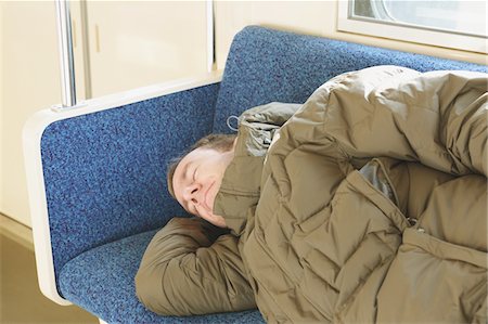 Adult man sleeping in a train Stock Photo - Rights-Managed, Code: 859-03755480