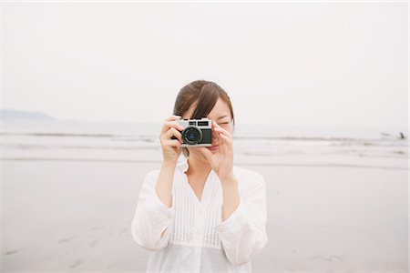 Young Woman Taking A Picture Stock Photo - Rights-Managed, Code: 859-03779879