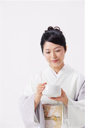 Woman In Kimono Holding Japanese Tea Cup Stock Photo - Rights-Managed, Code: 859-03779949