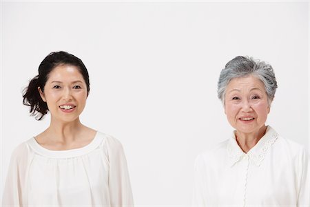 photos of 70 year old women faces - Mother And Adult Daughter Smiling Stock Photo - Rights-Managed, Code: 859-03779993