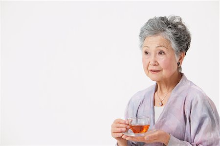 simsearch:859-03779954,k - Senior Woman Holding Cup Of Tea Stock Photo - Rights-Managed, Code: 859-03780027