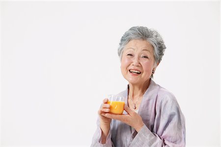 simsearch:859-03779954,k - Senior Woman Holding Glass Of Juice Stock Photo - Rights-Managed, Code: 859-03780028