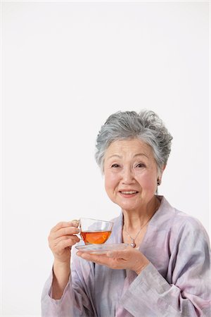 simsearch:859-03779954,k - Senior Woman Holding Cup Of Tea Stock Photo - Rights-Managed, Code: 859-03780030