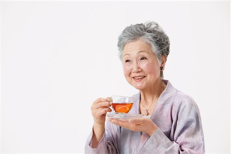 simsearch:859-03779954,k - Senior Woman Holding Cup Of Tea Stock Photo - Rights-Managed, Code: 859-03780032