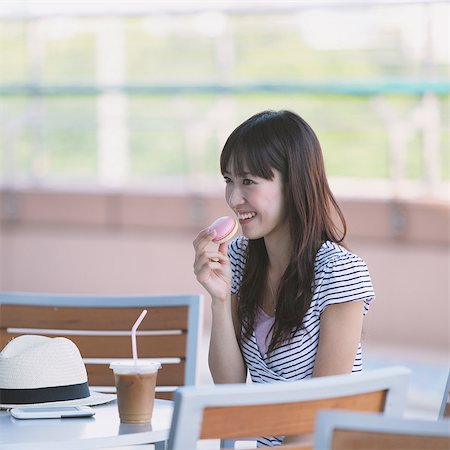 delicious enjoying food - Young Woman Enjoying Food Stock Photo - Rights-Managed, Code: 859-03780166